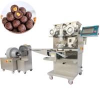 O chocolate encheu as bolas da proteína da manteiga de amendoim do chocolate da bola da data que fazem a máquina/a máquina de rolamento bola da data