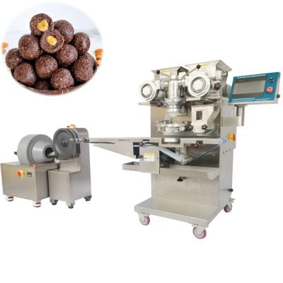 O chocolate encheu as bolas da proteína da manteiga de amendoim do chocolate da bola da data que fazem a máquina/a máquina de rolamento bola da data
