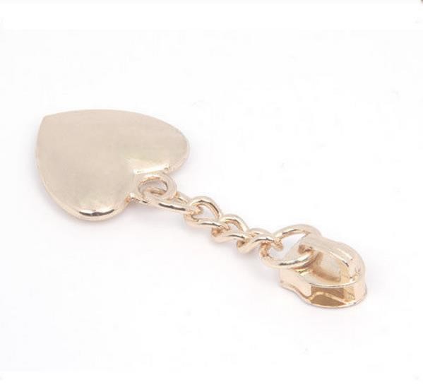 Слайдер молнии металла плакировкой золота сияющий, сердце сформировал тяги молнии для курток/пальто