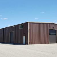 Low cost China Factory Customized Prefabricated Metal Building Kits Workshop Welding Steel Structures Warehouse Building