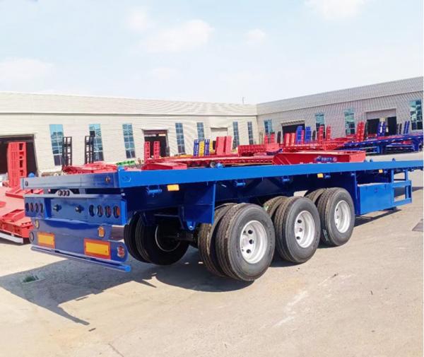 Truck Trailer Flatbed Semi Trailer With 30-60 Tons Loading Capacity And 1 Tool Box Big Chamber