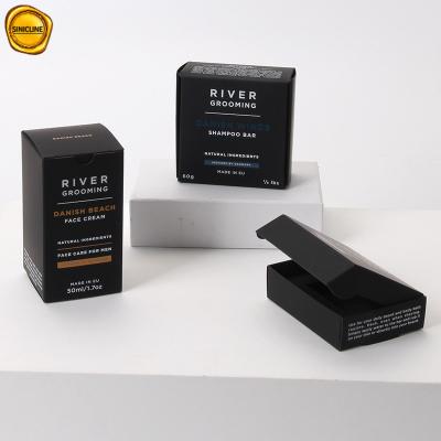 O empacotamento preto dos cuidados pessoais encaixota a caixa de papel do presente da caixa de cartão