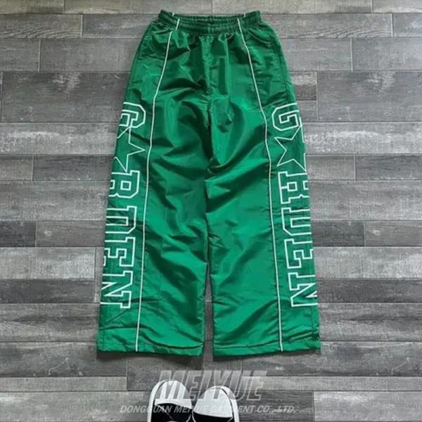 Coupe-vent personnalisé Pantalon léger en nylon Pantalon à tache Pantalon à large jambe Écran d'impression à rayures Pantalon à sueur pour hommes Pantalon à sac