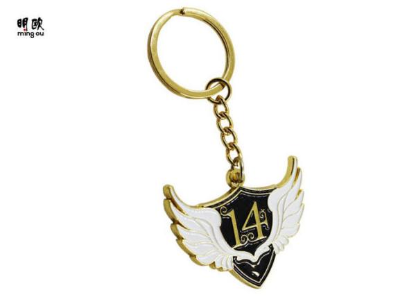 Wing Shaped Metal Key Ring Gold Finishing With White And Black Enamel