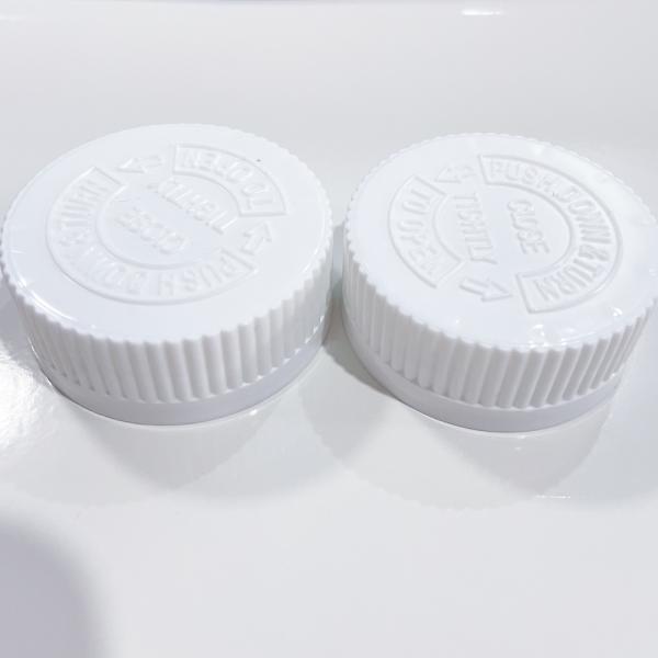 Capa de plástico resistente a los niños de 38 mm con tapa de tornillo para botellas de plástico asequible