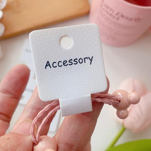 Tarjetas plegables para coleteros en relieve, texto negro, 100 unidades