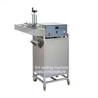 Machine continue de cachetage de papier d'aluminium d'induction électromagnétique