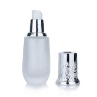 Garrafa cilíndrica congelada de vidro branco de 45 ml com tampa de prata para garrafas de vidro cosméticos
