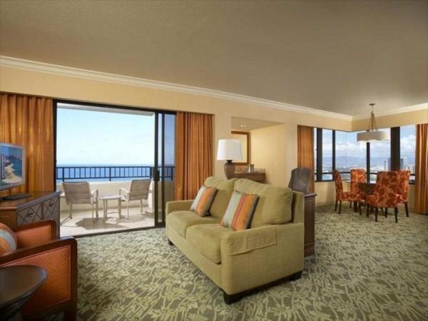 Sakiao interior designer for Hotel guestroom furniture by wood headboard beds with rattan armchairs and TV stand cabinet
