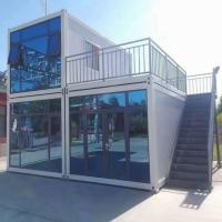 Maison de conteneurs commerciaux à paquet plat Panneau sandwich en laine de roche Maison de conteneurs préfabriquée