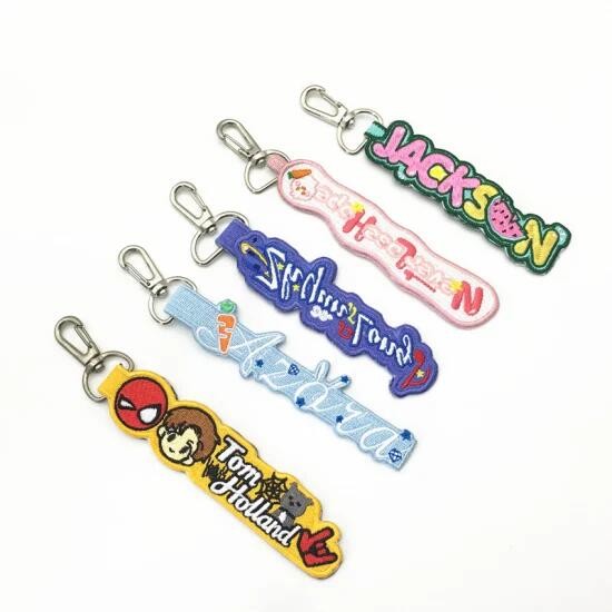 Custom OEM Cute Creative Embroidered Name Keychains Twill Fabirc With Merrow