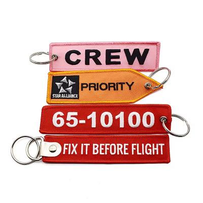 Wholesale Olecranon Hook Cheap Custom Flight Fabric Embroidery Jet tag Woven Keychain With Your Own Logo