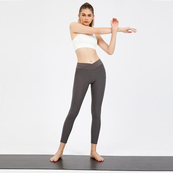 A ioga veste o Spandex 50% que de 50% as senhoras misturadas de nylon malham calças e partes superiores aptas
