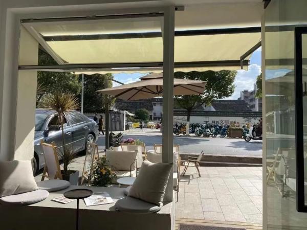 View Vineyard Folding Window Showcasing Grape Harvest Activities from Living Rooms