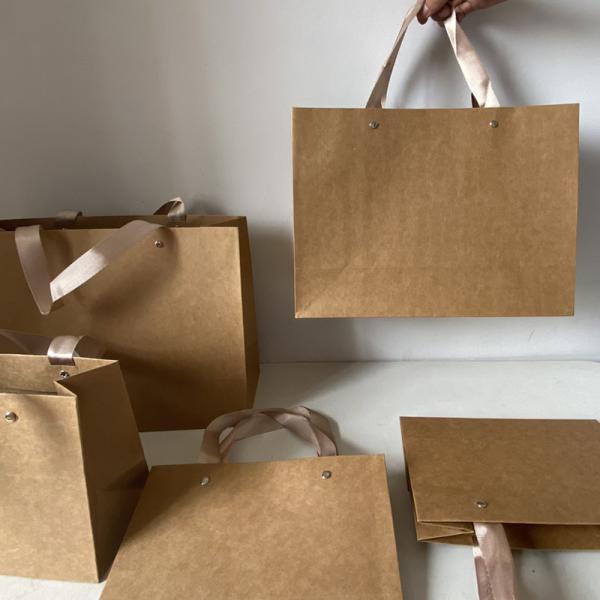 Sacs fourre-tout en papier épais Sac de magasinage universel pour vêtements Portable