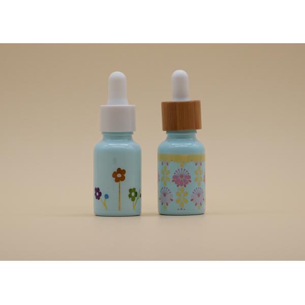 O conta-gotas azul do óleo essencial do revestimento engarrafa a garrafa cerâmica branca para cuidados pessoais