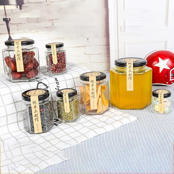 Frascos de vidro dados forma sextavados do armazenamento do tampão de parafuso, doce Honey Jars de vidro da especiaria