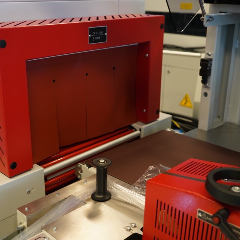 Compact Auto Heat Shrink Film Packaging Machine For Panels / Building Products