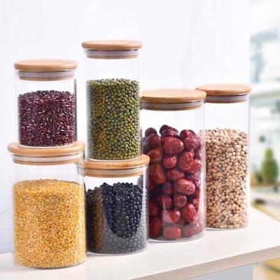 O armazenamento alto do vidro de Borosilicate do fruto seco engarrafa a tampa de bambu sustentável do ODM