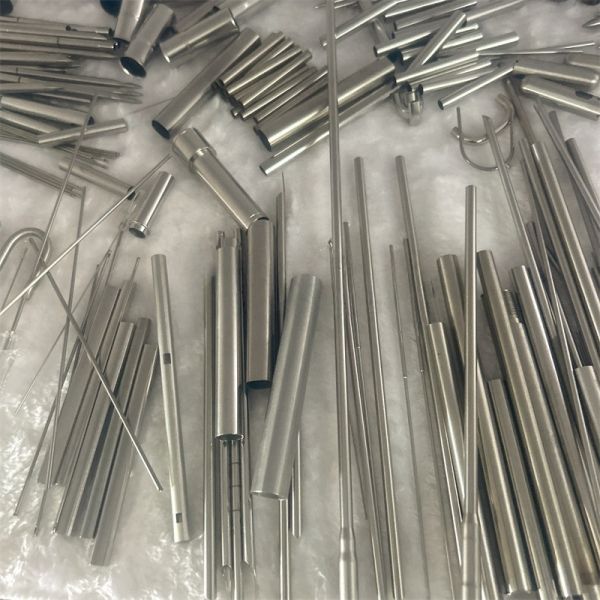 Customized processing of sandblasting scale for stainless steel capillary slotted flared reducing head.