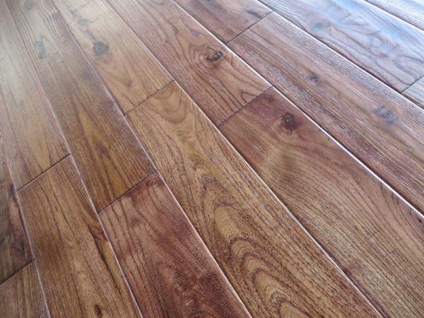 different stained Asian Teak solid hardwood flooring with distressed finishing