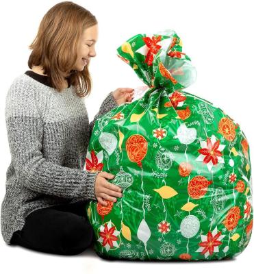 O papel de embrulho plástico colorido enorme ensaca 36 x 44 polegadas com laços de corda