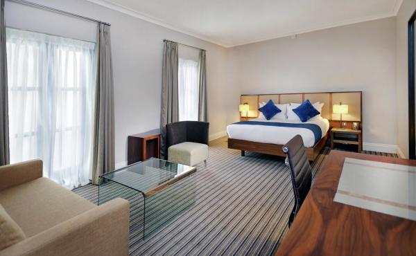 Budget Hotel Bedroom Furniture Leather bed with Leisure chairs and Wood TV Stand Cabinets