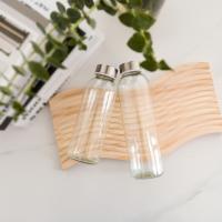 Bouteille d'eau en verre transparente de 16 oz avec couvercle en acier inoxydable