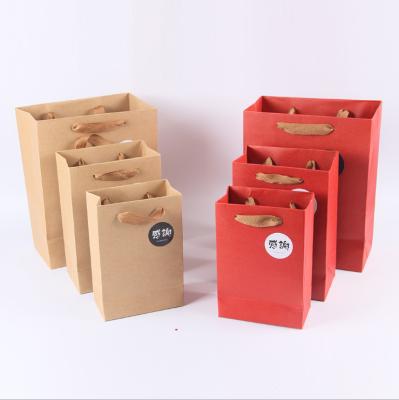 Sacos de papel da compra de Kraft do papel do cartão com logotipo feito sob encomenda dos punhos impressos