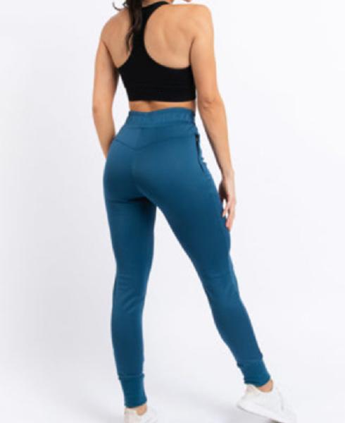 Das mulheres atléticas do Sweatpants das mulheres do esporte basculadores do treinamento