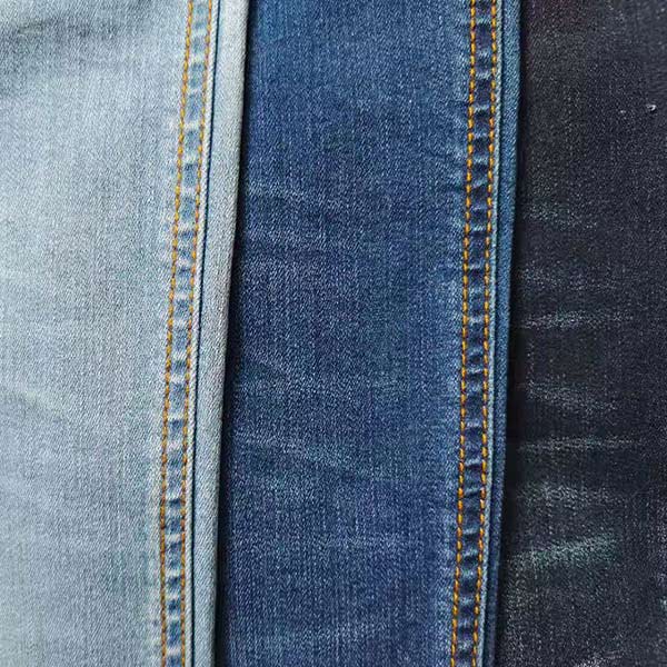 Сплетите джинсовую ткань TR индиго тканей 90*62 11OZ зимы падения Twill Stretchy смешал материальное