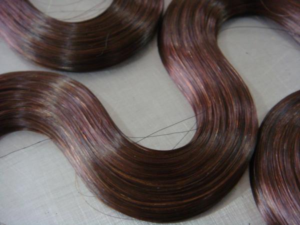 La bande ondulée dans les extensions de cheveux 5 grammes - 8 grammes