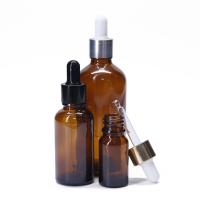 Botellas de vidrio marrón con gotero de medición