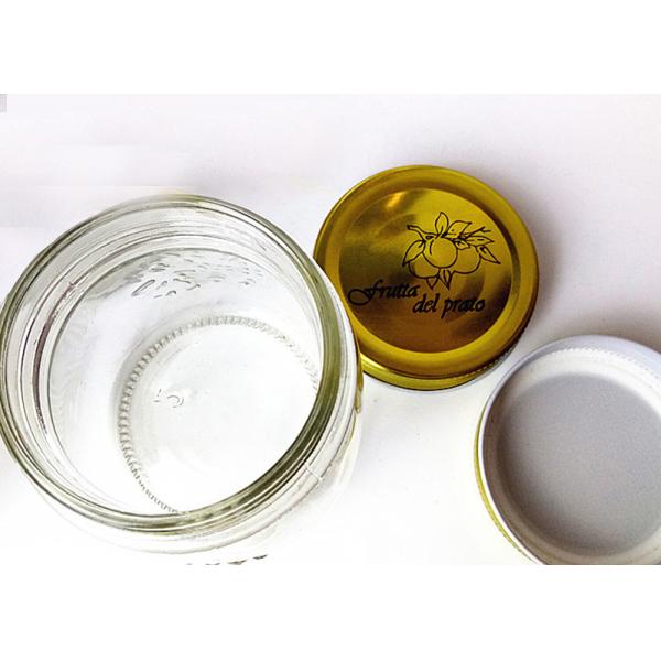 Frascos de vidro cinzelados claros do armazenamento com a tampa do parafuso da cor do ouro em volta da forma