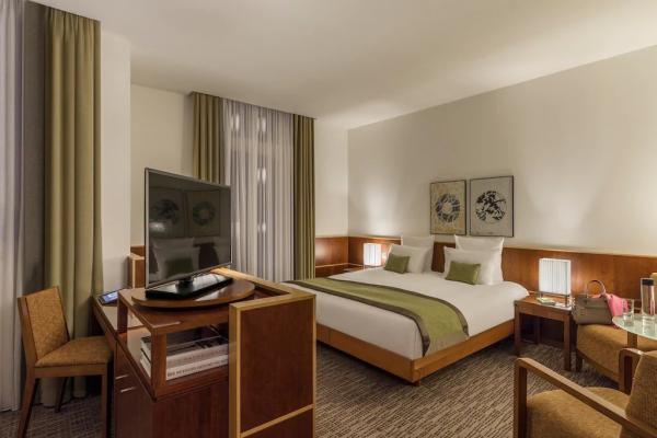 Madagascar hotel bedroom furniture set of wood headboard bed with combine desk table and fabric cushion chairs