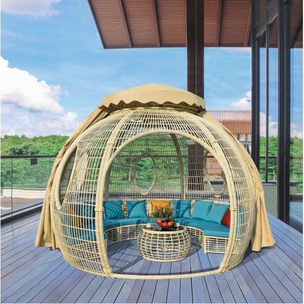 Transform Your Patio into a Relaxing Haven with a Rattan Daybed and Canopy