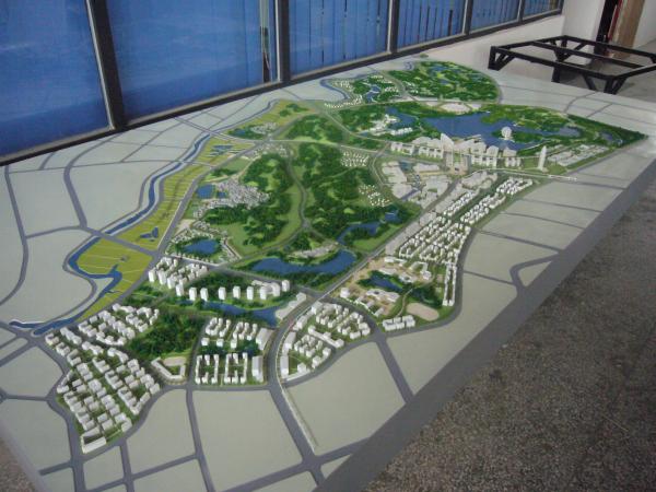 Architectural Model of Urban Master Plan with Green Landscape, Roads, and Mixed-Use Developments