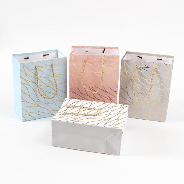 Gold Foil Deep Embossed Paper Gift Bags For Festivals Gifting Business Favors