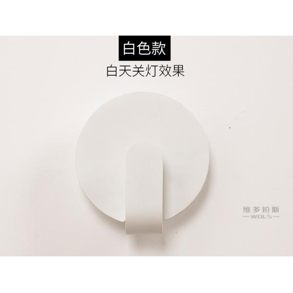 Modern simple and creative bedroom bedroom iron art wall lamp.