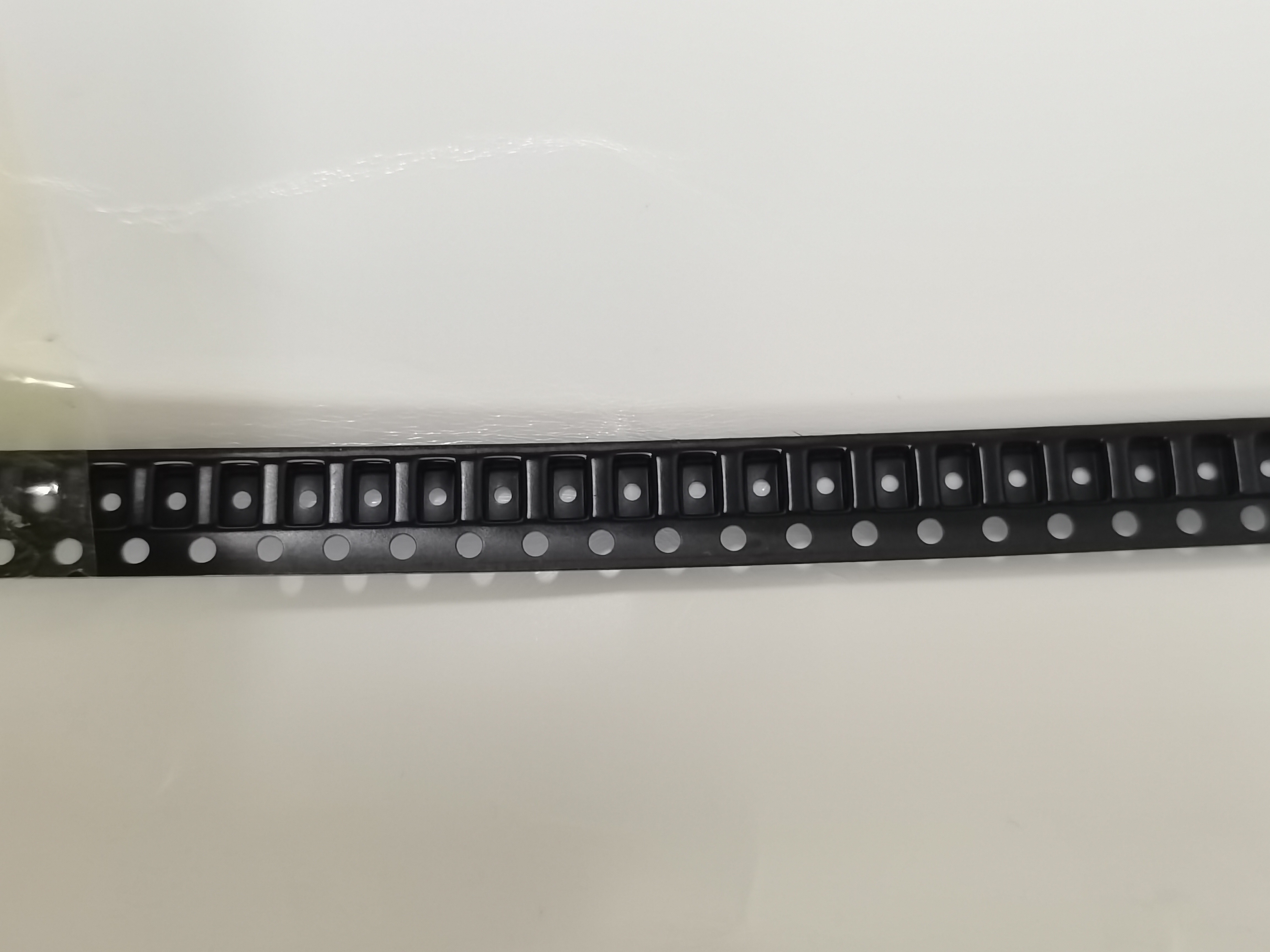 Black PS Embossed Carrier Tape for Precision SMT Component Pocket Packaging