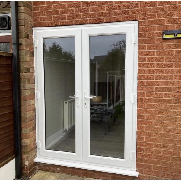 Puertas de vidrio a prueba de viento con doble bisagra PVC Puerta de vidrio resistente a impactos ODM