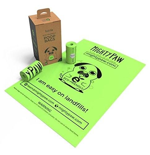 Papel - sacos Compostable isolados do desperdício do cão