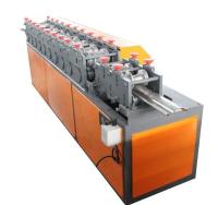 L'épaisseur complètement automatique de 0.7-1.0mm a galvanisé le petit pain en acier de porte de volet formant la machine avec 12 groupes de formation