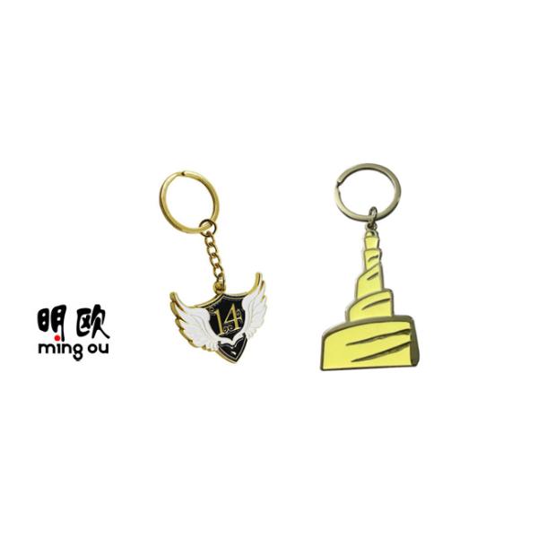 Wing Shaped Metal Key Ring Gold Finishing With White And Black Enamel