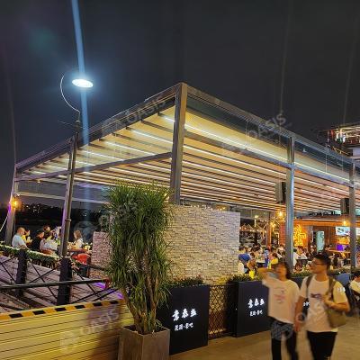 Pergola imperméable à l'eau de structure en aluminium de 4mx3m avec auvents à commande à distance en tissu PVC