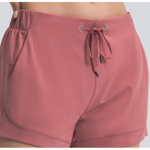 Ход фитнеса женщин замыкает накоротко высокие спорт талии разминка замыкает накоротко с карманами