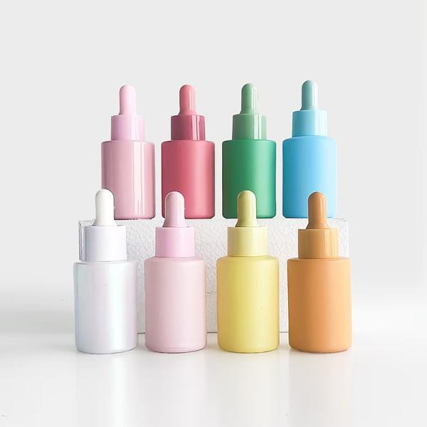 Bouteille d' huile essentielle de couleur macaron en 30 ml avec pompe en plastique PP et matériau en verre