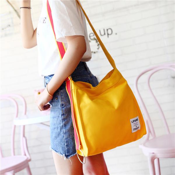 New canvas small ring shoulder Messenger bag simple portable leisure Joker bag women