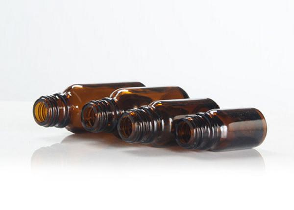 La fantaisie Amber Cosmetic Bottles Round Shape a adapté Logo Printing aux besoins du client