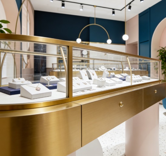 Straight Modular Jewelry Display Counter | Pink Navy Blue Gold Metal Edging | Arc Middle Island Counter Built-in Retail Store